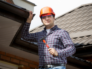 Davenport homeowner inspecting roof in October.