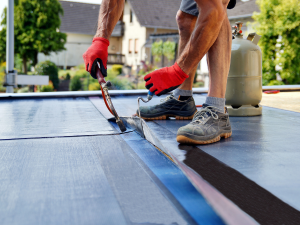 Flat roof installation by a professional Rock Island roofing contractor