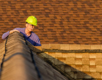 Inspecting a roof for water damage in Davenport.