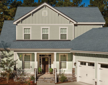 East Moline roofing services; home with GAF Cool Roof Timbeline Shingles